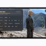 iPhone 18 Pro dalam orientasi lanskap menampilkan antarmuka Final Cut Camera dengan subjek berdiri di lanskap pegunungan dan pengaturan perekaman video.